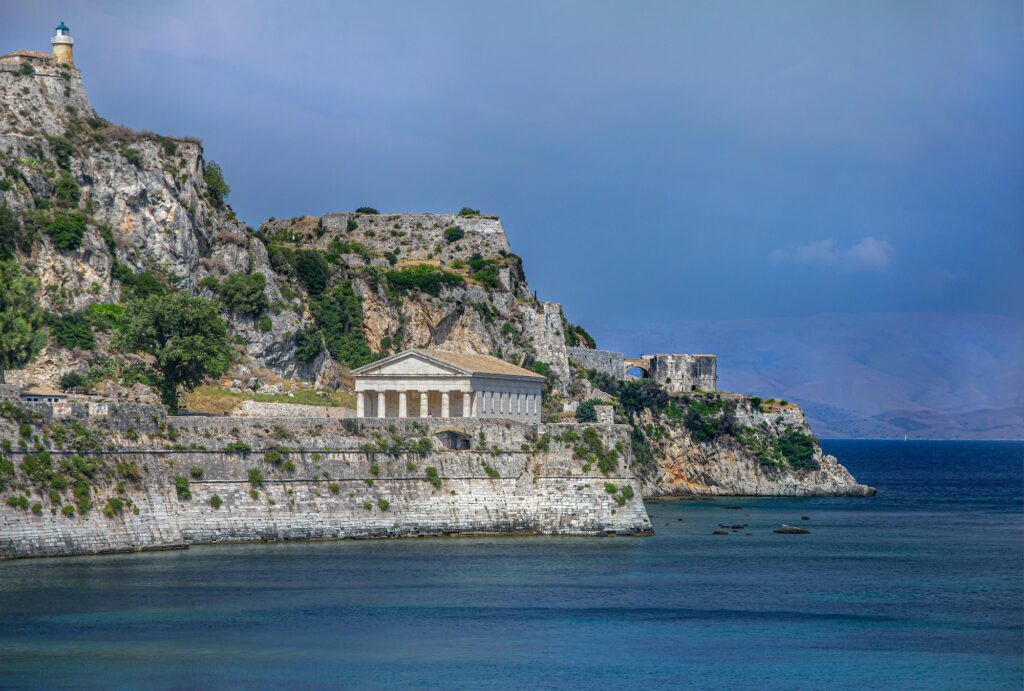 Corfu is a greek island and is directly accessible from Manchester