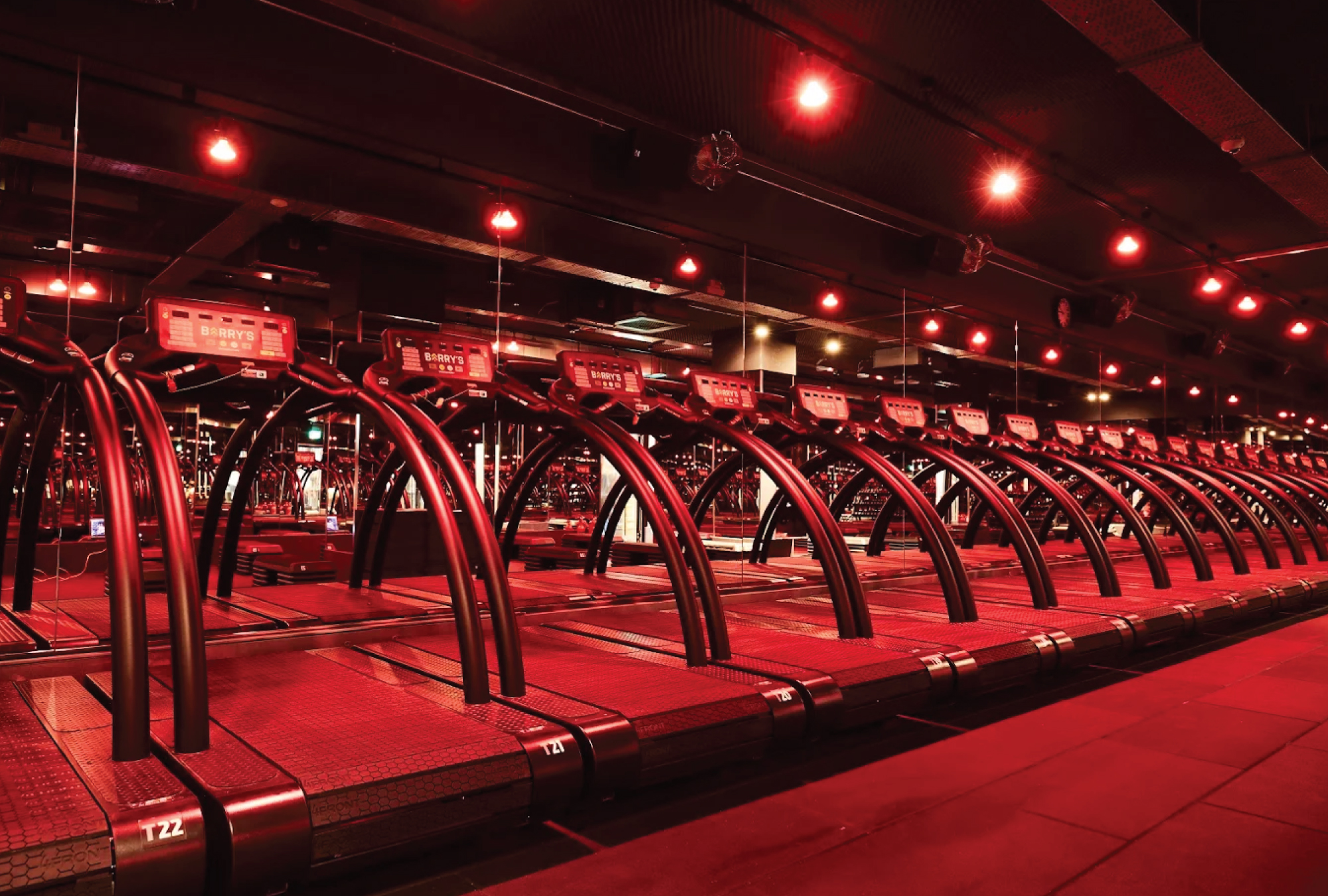 barry's manchester - row of treadmills